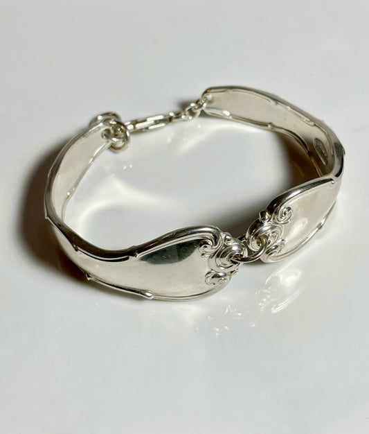 Silver bracelet made of spoon handles.